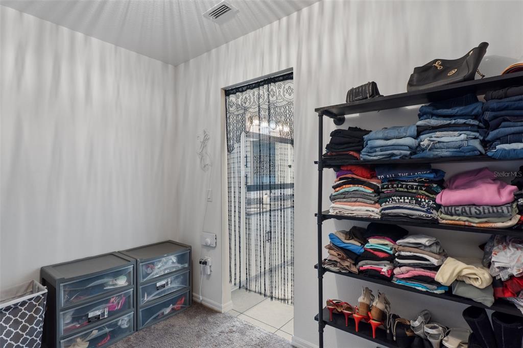 3313 Dorian Avenue Spring Hill, FL 34606 - Photo 25 of 57 a room with lots of different colored cloths