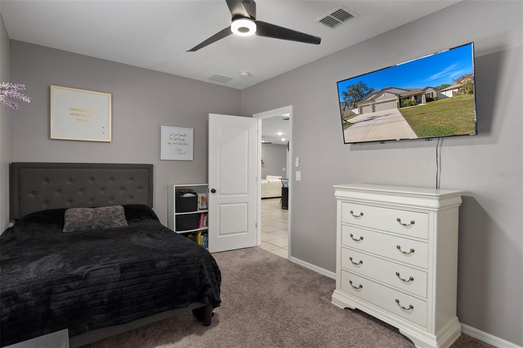 3313 Dorian Avenue Spring Hill, FL 34606 - Photo 32 of 57 a bedroom with a bed and a television