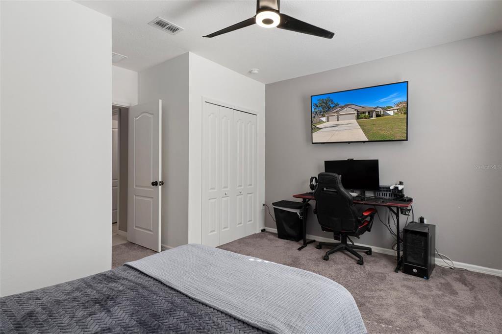 3313 Dorian Avenue Spring Hill, FL 34606 - Photo 37 of 57 a bedroom with a workspace