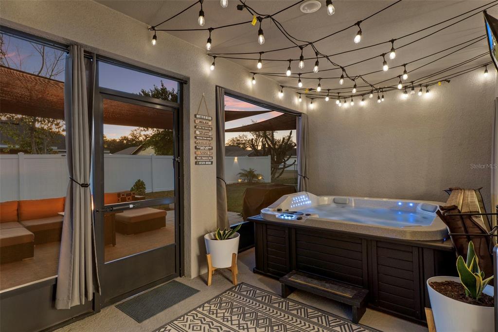 3313 Dorian Avenue Spring Hill, FL 34606 - Photo 42 of 57 a room with a chandelier and living room