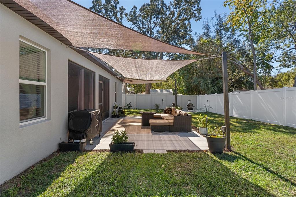 3313 Dorian Avenue Spring Hill, FL 34606 - Photo 54 of 57 a view of a house with backyard sitting area and garden