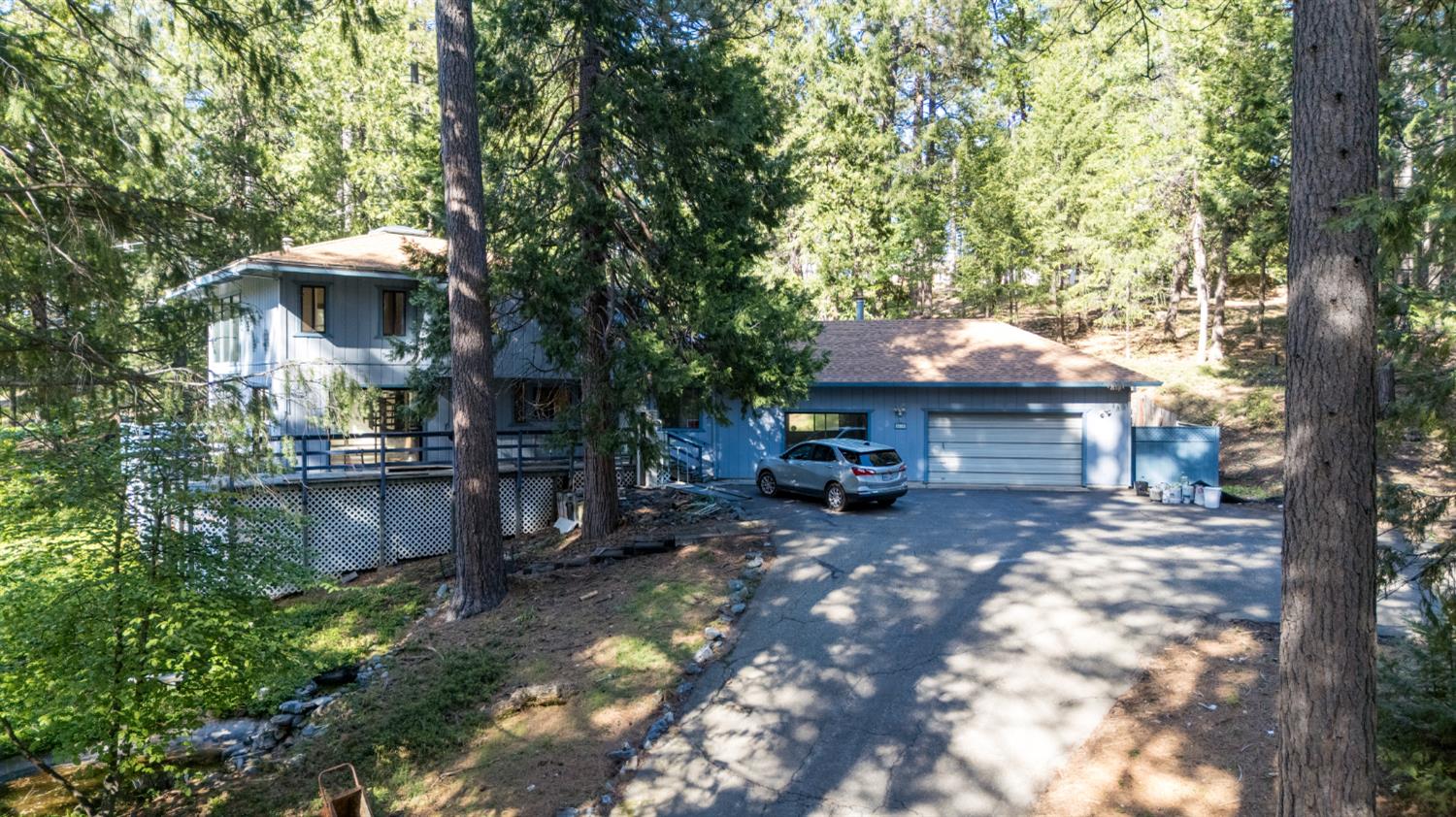 2070 King Of The Mountain Road Pollock Pines, CA 95726 - Photo 2 of 53 a view of a house with a yard and sitting area