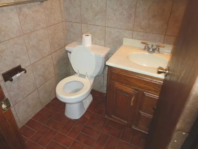 a bathroom with a toilet and a sink