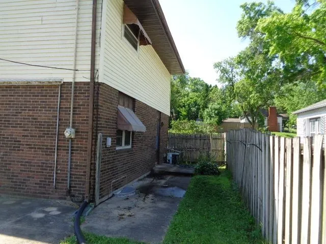 a view of a back yard of the house