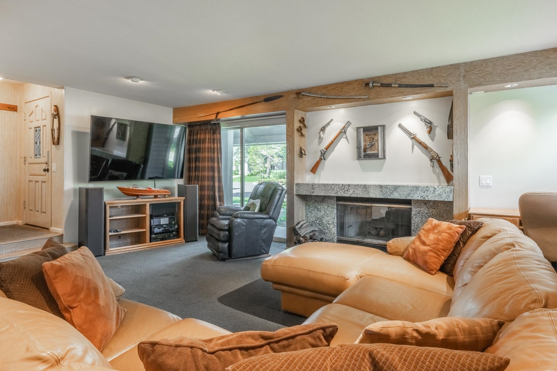 a living room with furniture and a flat screen tv