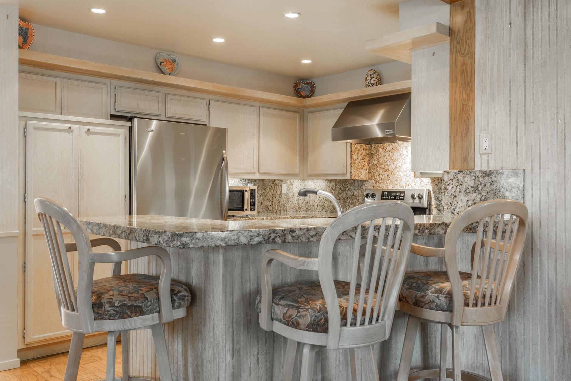 623 Golden Creek Road, Unit 623 Mammoth Lakes, CA 93546 - Photo 11 of 33 a kitchen with stainless steel appliances granite countertop a sink a stove and a refrigerator