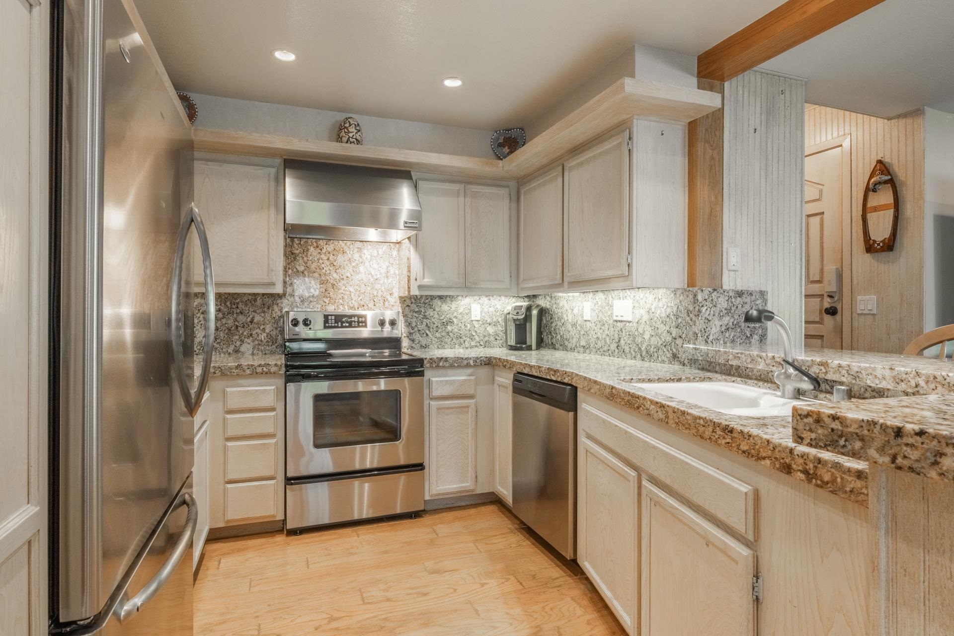 623 Golden Creek Road, Unit 623 Mammoth Lakes, CA 93546 - Photo 13 of 33 a kitchen with granite countertop a sink stainless steel appliances and cabinets