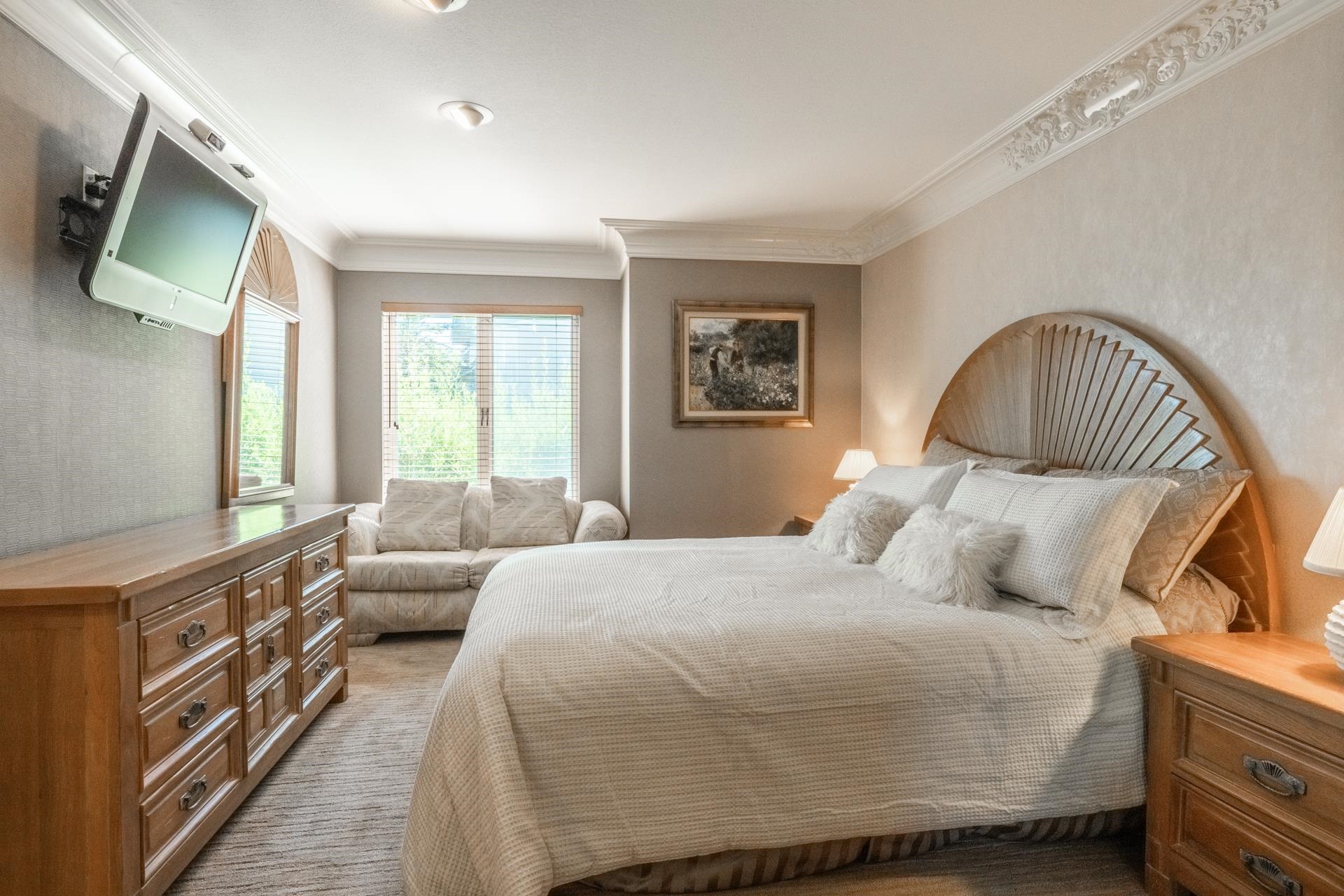 623 Golden Creek Road, Unit 623 Mammoth Lakes, CA 93546 - Photo 19 of 33 a bedroom with a bed a couch and a flat tv screen on dresser