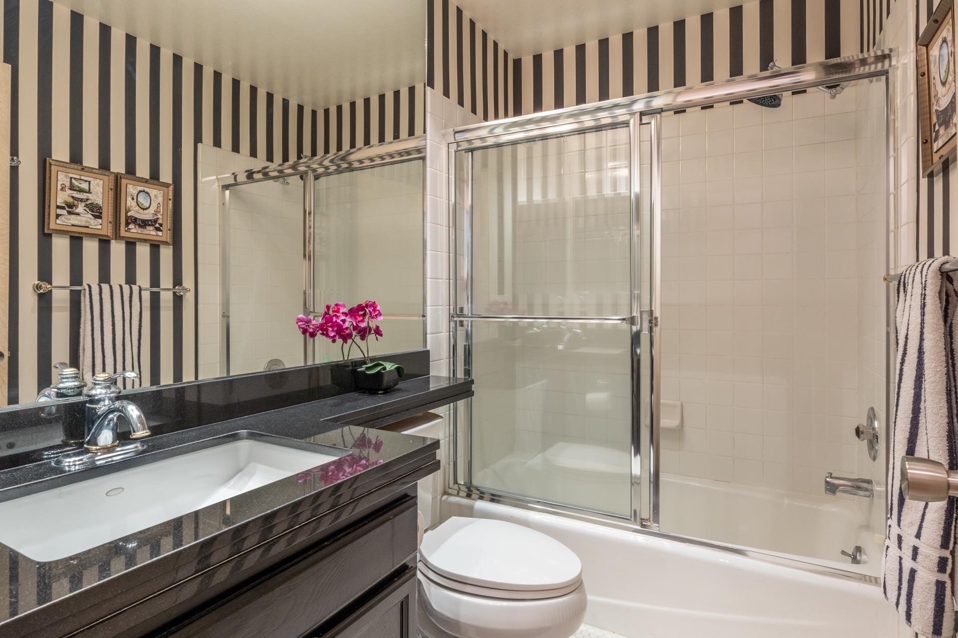 623 Golden Creek Road, Unit 623 Mammoth Lakes, CA 93546 - Photo 26 of 33 a bathroom with a granite countertop sink a toilet and shower