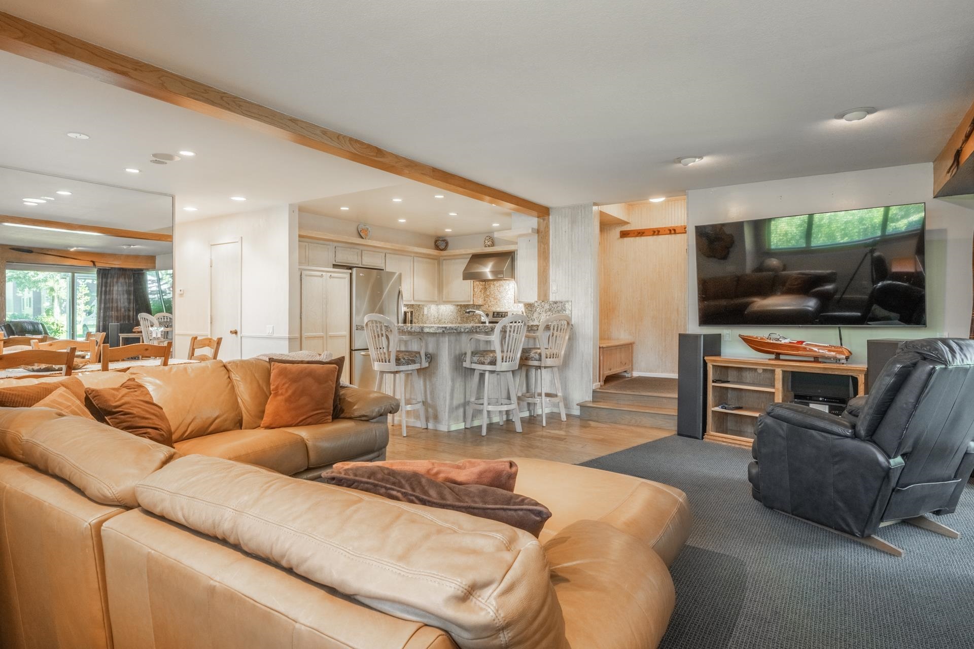 623 Golden Creek Road, Unit 623 Mammoth Lakes, CA 93546 - Photo 4 of 33 a living room with furniture and a flat screen tv