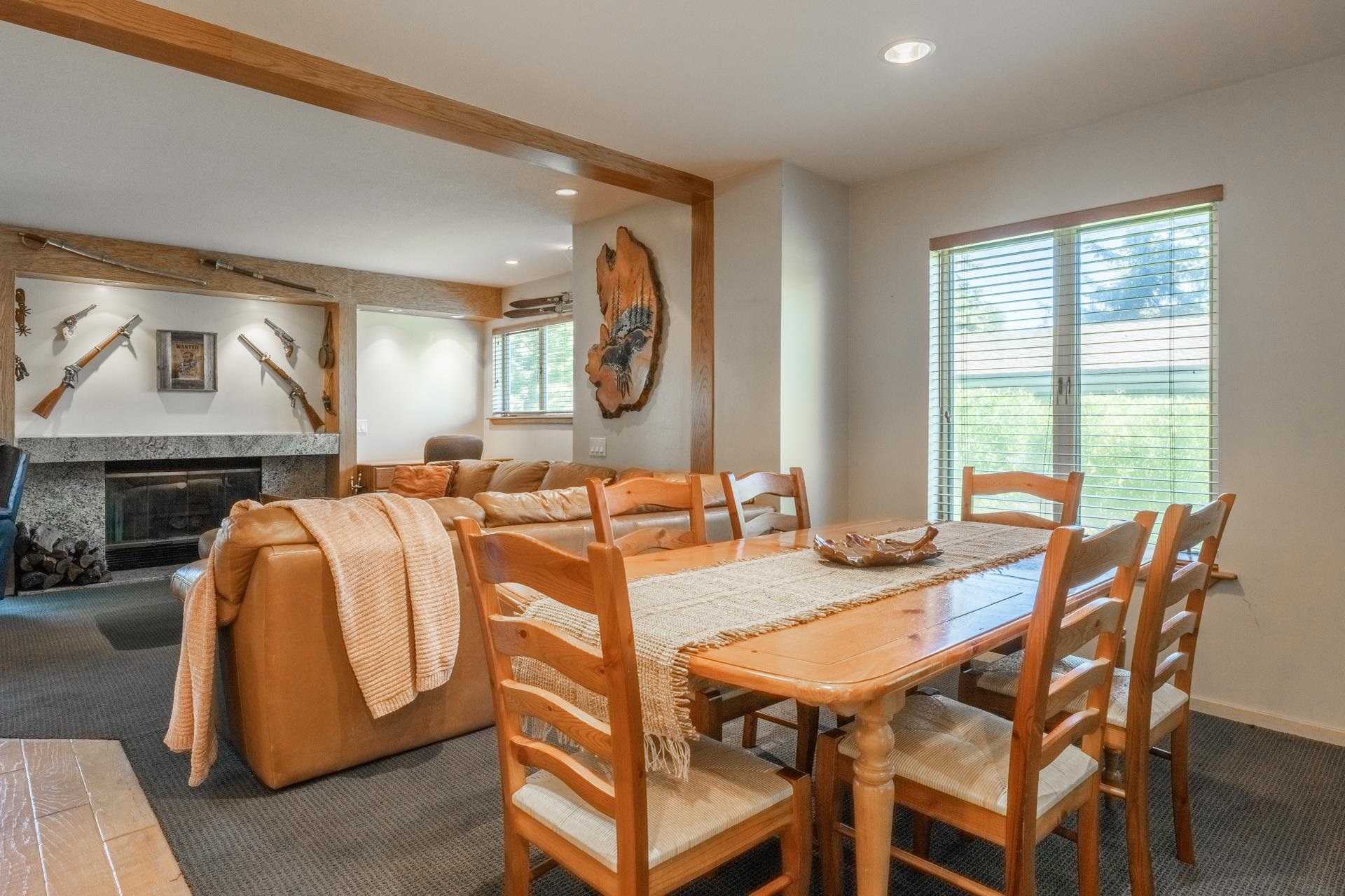 623 Golden Creek Road, Unit 623 Mammoth Lakes, CA 93546 - Photo 8 of 33 a view of a dining room with furniture and a fireplace