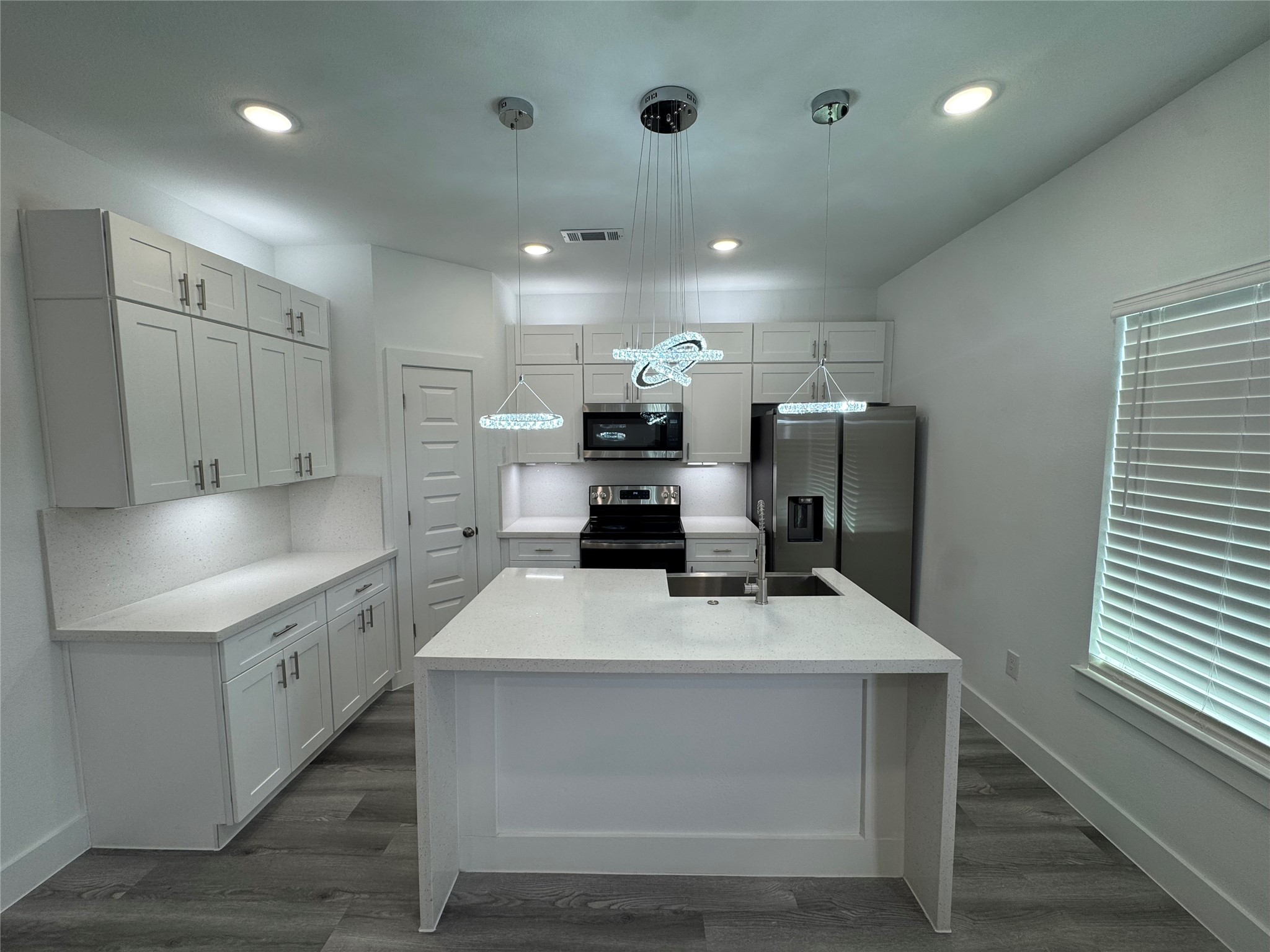 4604 Bricker Street, Unit A Houston, TX 77051 - Photo 1 of 15 a kitchen with a sink appliances and cabinets