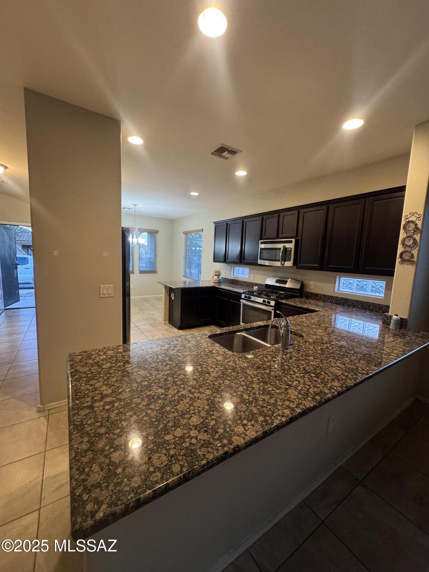 8697 West Denstone Road Marana, AZ 85653 - Photo 5 of 21 Open Kitchen with extended island.