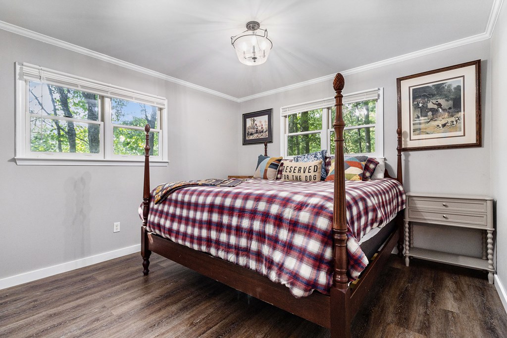 220 Fox Den Circle Jasper, GA 30143 - Photo 14 of 29 a bed sitting in a bedroom next to a window