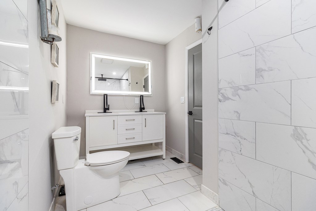 220 Fox Den Circle Jasper, GA 30143 - Photo 16 of 29 a bathroom with a toilet sink and shower