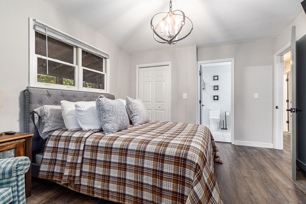 220 Fox Den Circle Jasper, GA 30143 - Photo 19 of 29 a bedroom with a bed and wooden floor