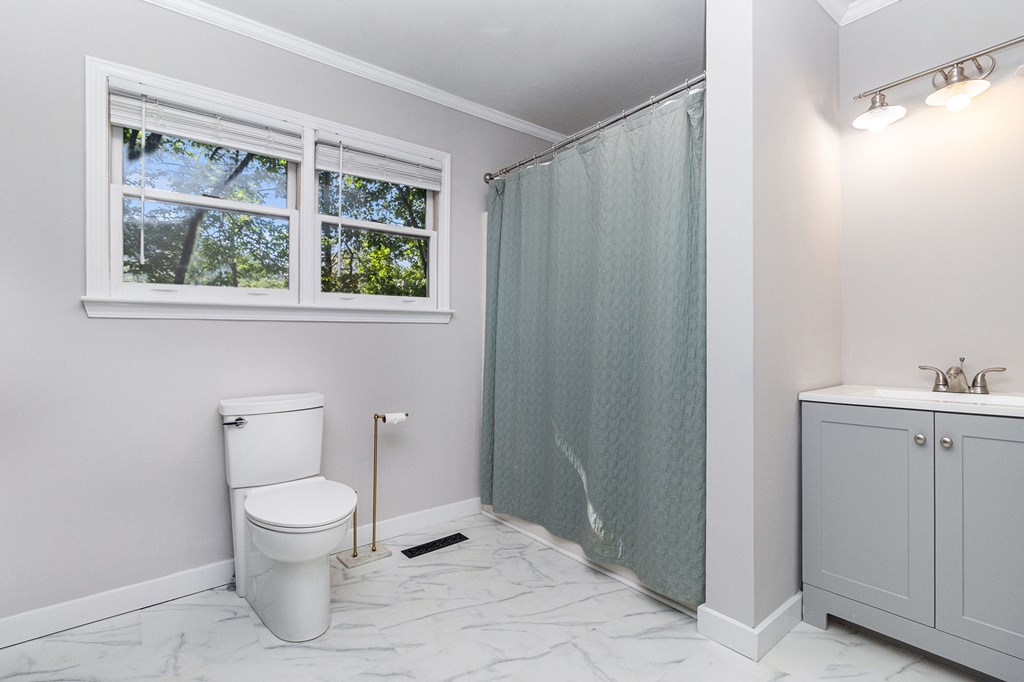 220 Fox Den Circle Jasper, GA 30143 - Photo 20 of 29 a white toilet sitting next to a bathroom sink