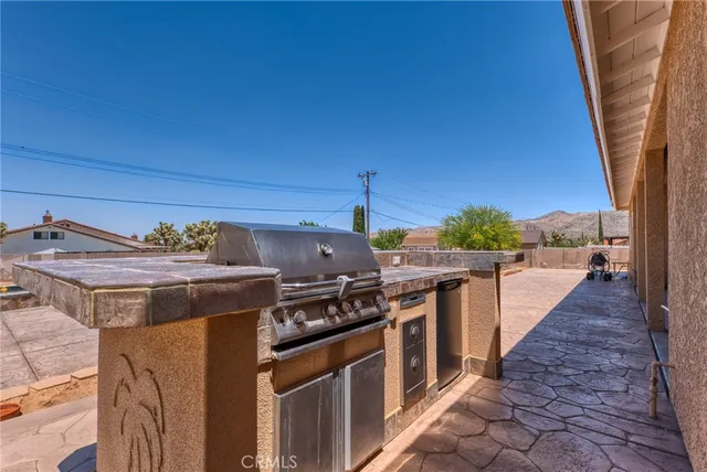 an aerial view of residential houses with outdoor space and parking