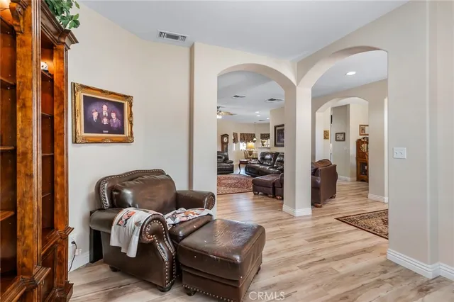a living room with furniture and a rug