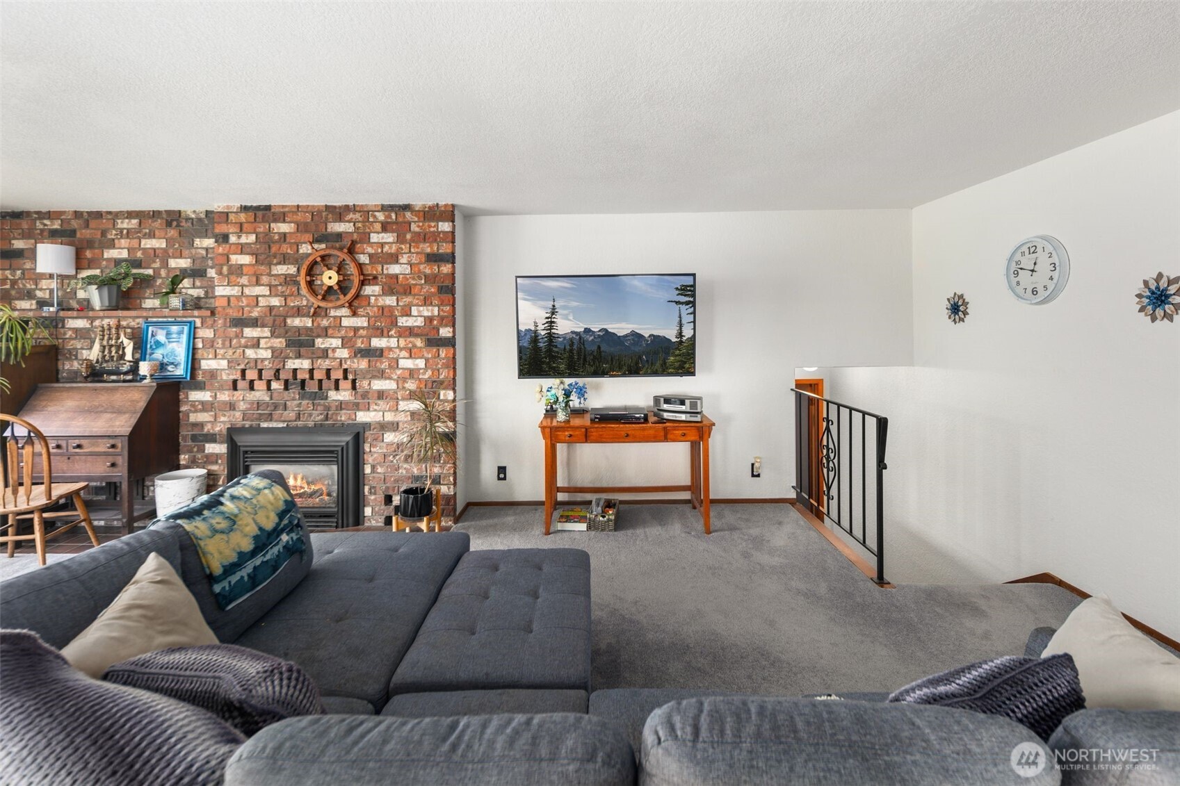 17464 Dunbar Road, Unit 1 Mount Vernon, WA 98273 - Photo 12 of 40 a living room with furniture and a flat screen tv