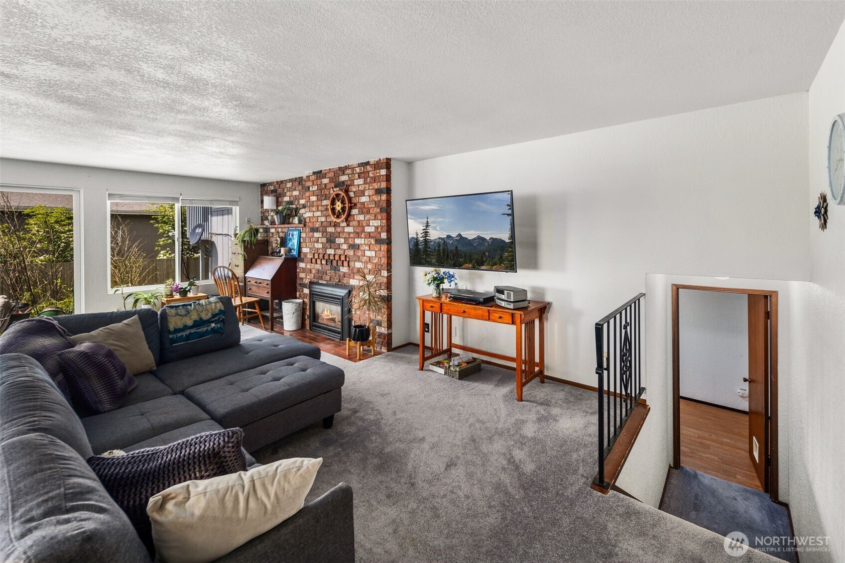 17464 Dunbar Road, Unit 1 Mount Vernon, WA 98273 - Photo 14 of 40 a living room with furniture and a flat screen tv