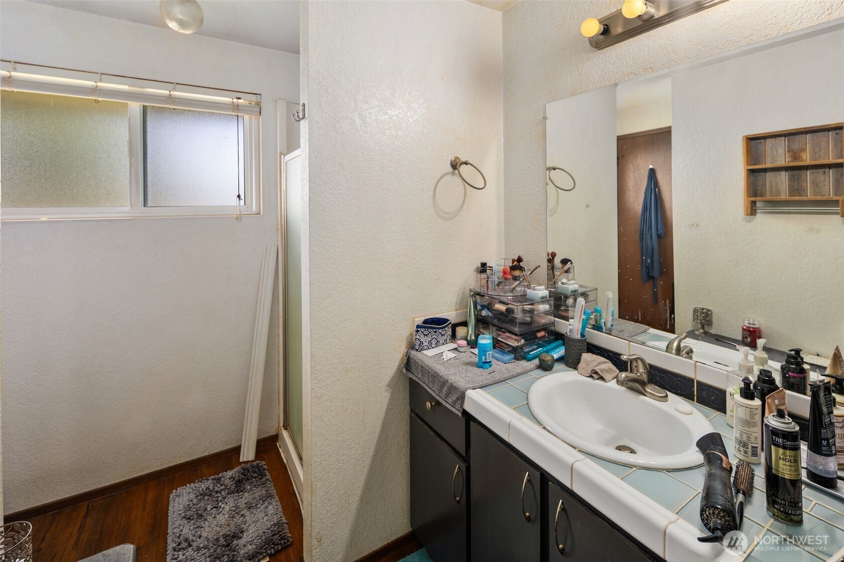 17464 Dunbar Road, Unit 1 Mount Vernon, WA 98273 - Photo 18 of 40 a bathroom with a sink vanity granite and a mirror