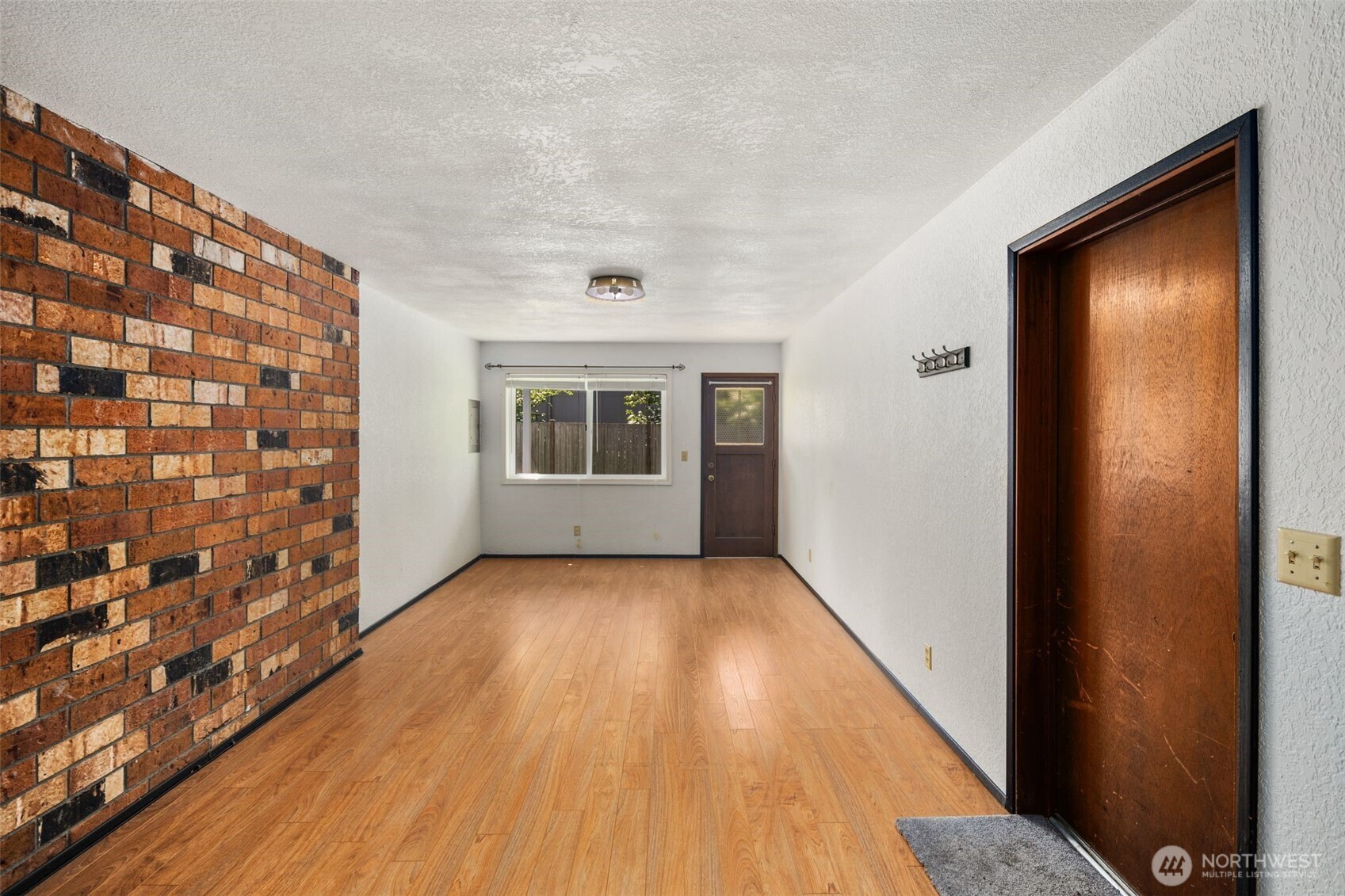 17464 Dunbar Road, Unit 1 Mount Vernon, WA 98273 - Photo 25 of 40 a view of livingroom with hardwood floor and hallway