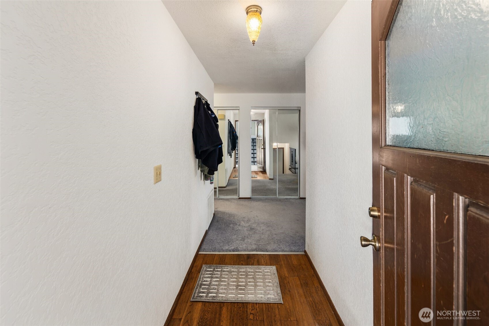 17464 Dunbar Road, Unit 1 Mount Vernon, WA 98273 - Photo 3 of 40 a view of a hallway view with wooden floor and staircase