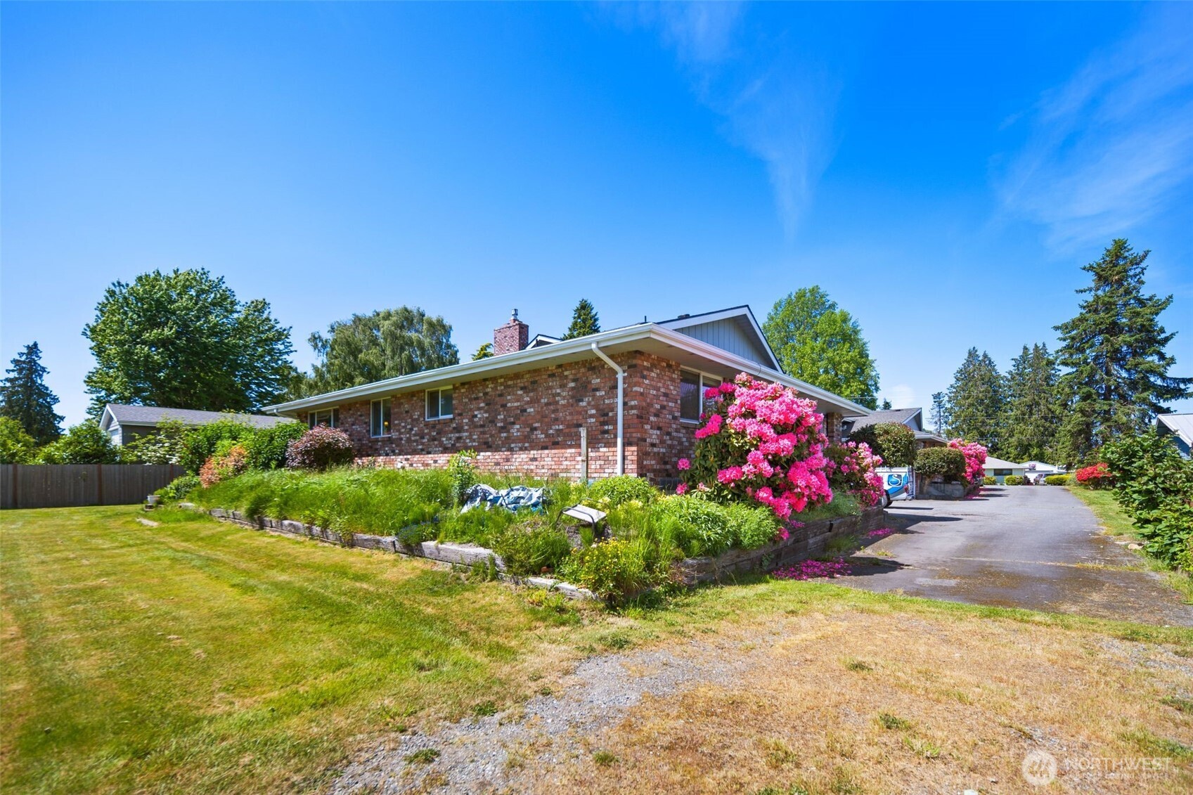 17464 Dunbar Road, Unit 1 Mount Vernon, WA 98273 - Photo 35 of 40 a view of a garden with flowers and plants