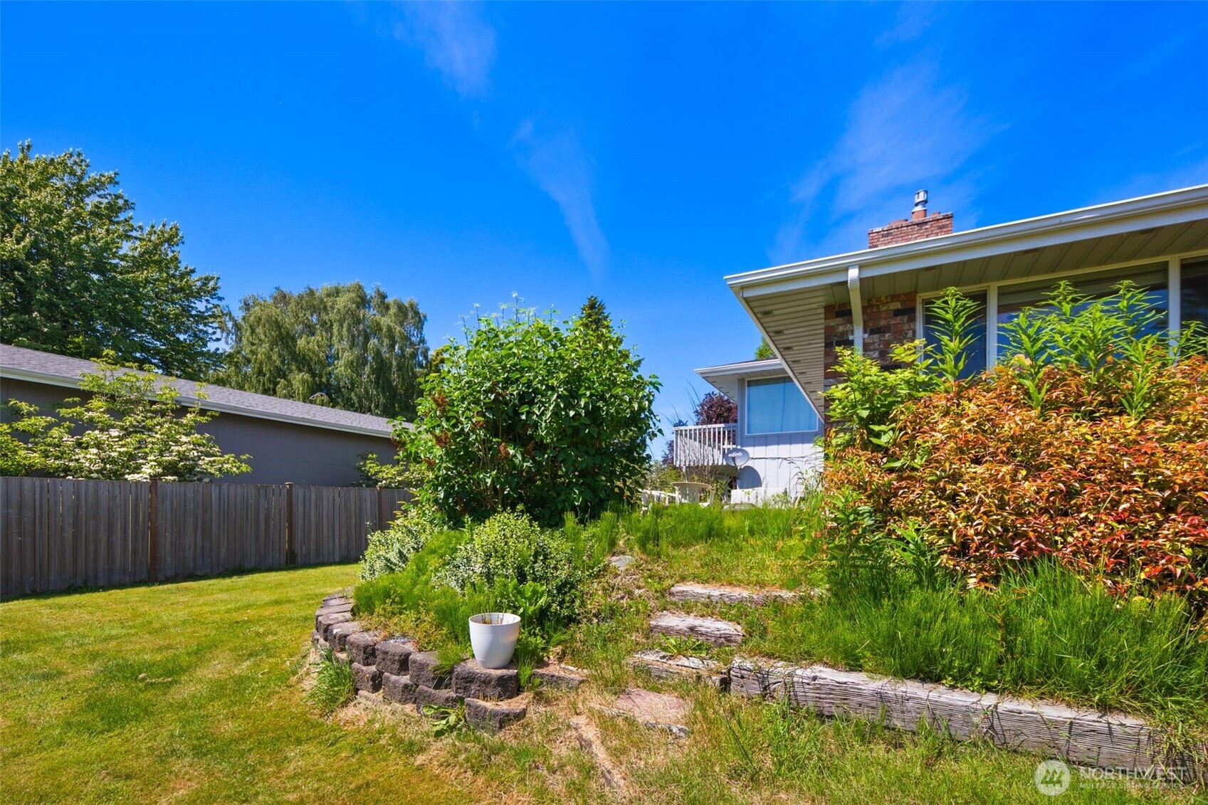 17464 Dunbar Road, Unit 1 Mount Vernon, WA 98273 - Photo 38 of 40 a front view of a house with garden
