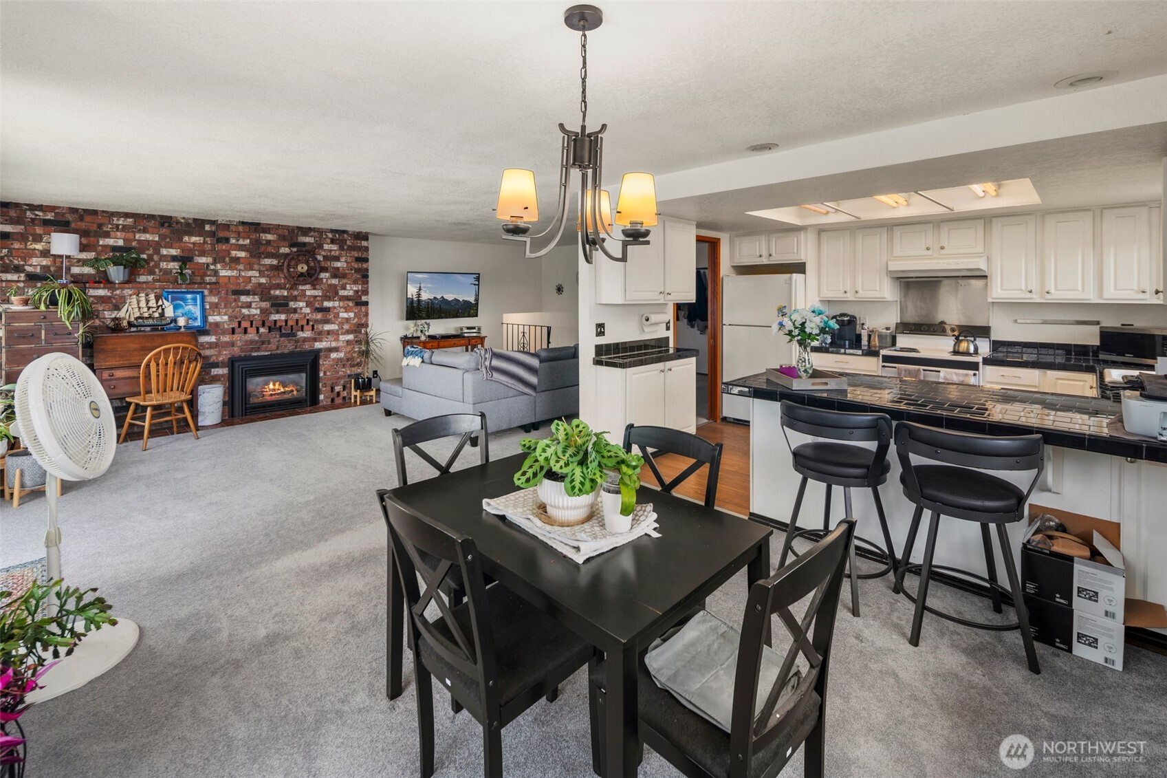 17464 Dunbar Road, Unit 1 Mount Vernon, WA 98273 - Photo 10 of 40 a view of a dining room with furniture and a chandelier