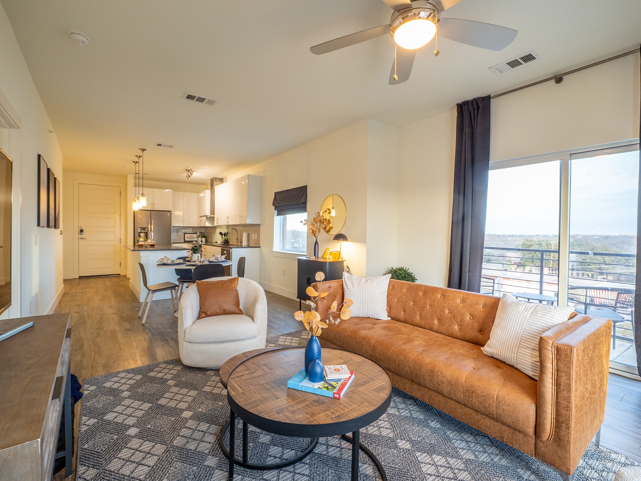 6444 Burnet Road, Unit 509 Austin, TX 78757 - Photo 11 of 32 An open-concept living space integrates a well-appointed kitchen and balcony access for effortless entertaining.