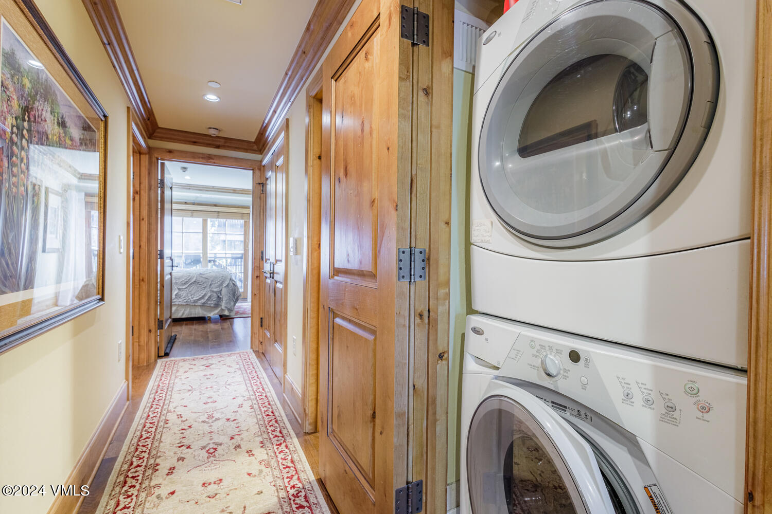 434 South Frontage Road East, Unit 402 Vail, CO 81657 - Photo 14 of 44 a view of a hallway with washer and dryer