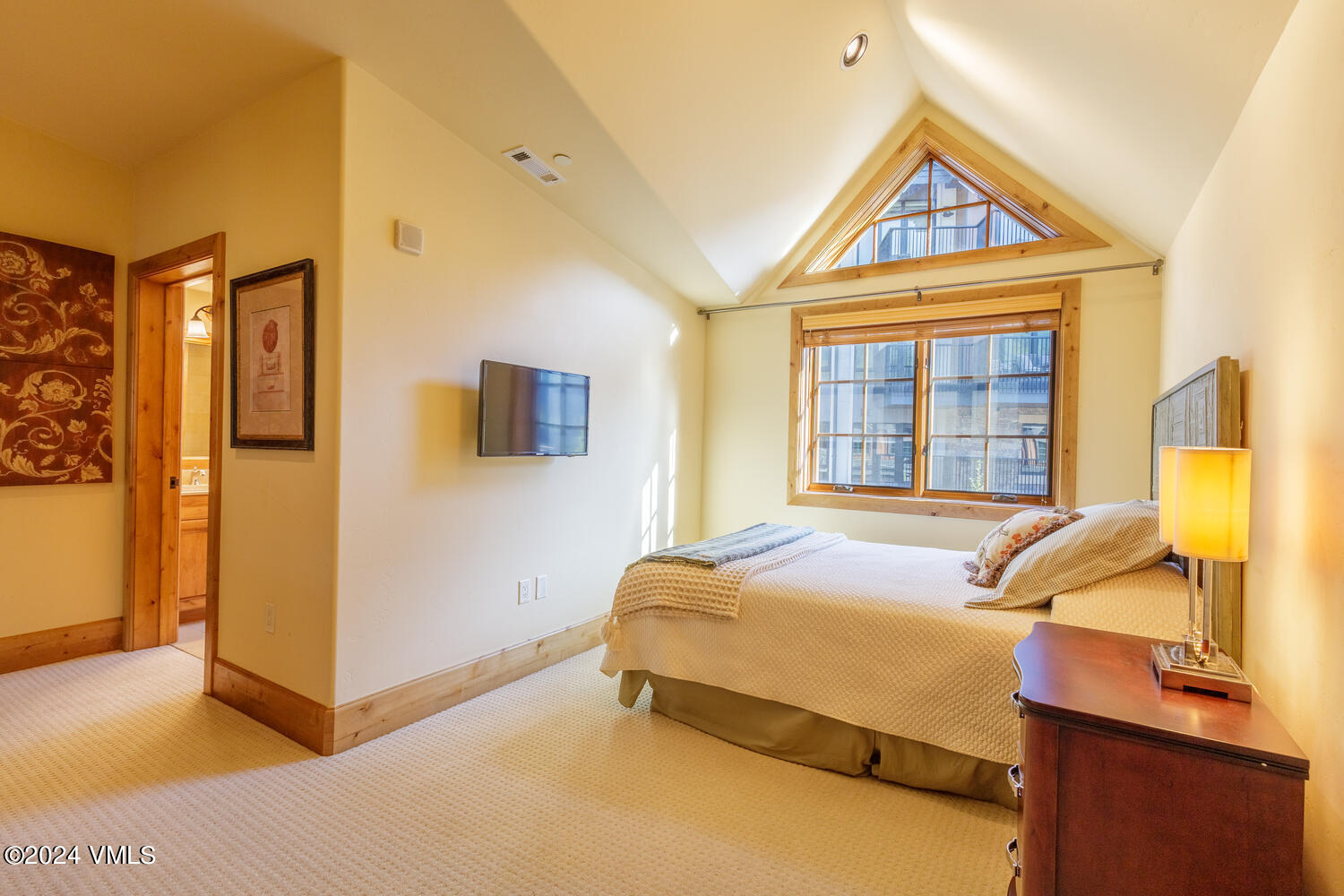 434 South Frontage Road East, Unit 402 Vail, CO 81657 - Photo 19 of 44 a bedroom with a bed and a window