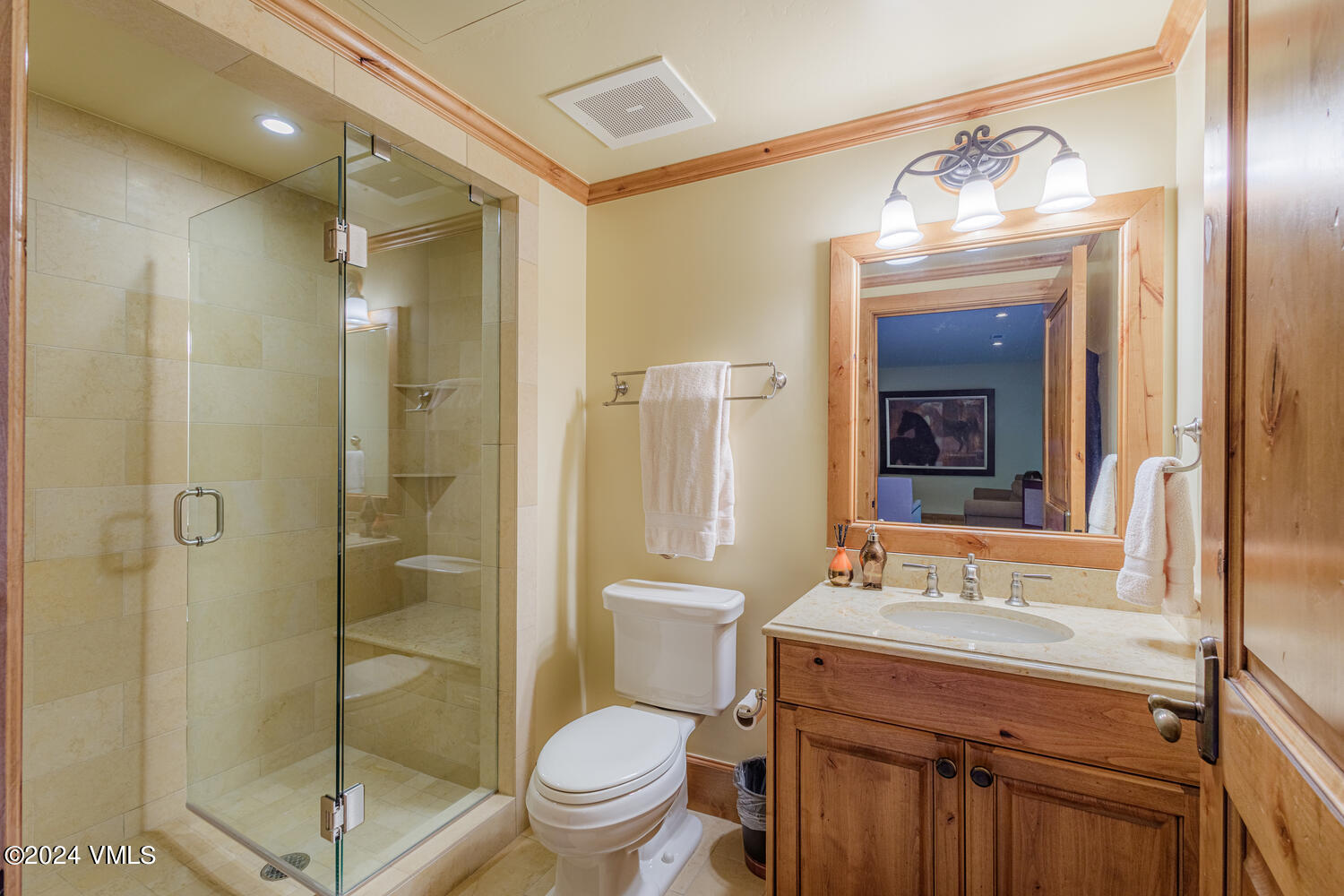 434 South Frontage Road East, Unit 402 Vail, CO 81657 - Photo 23 of 44 a bathroom with a toilet a sink and glass door