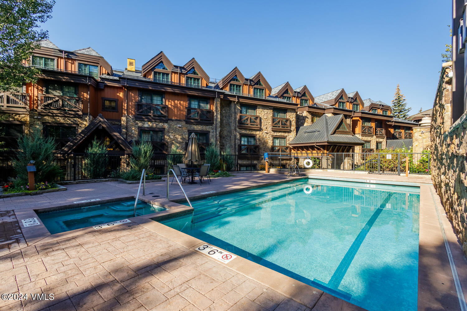 434 South Frontage Road East, Unit 402 Vail, CO 81657 - Photo 26 of 44 a front view of a house with swimming pool