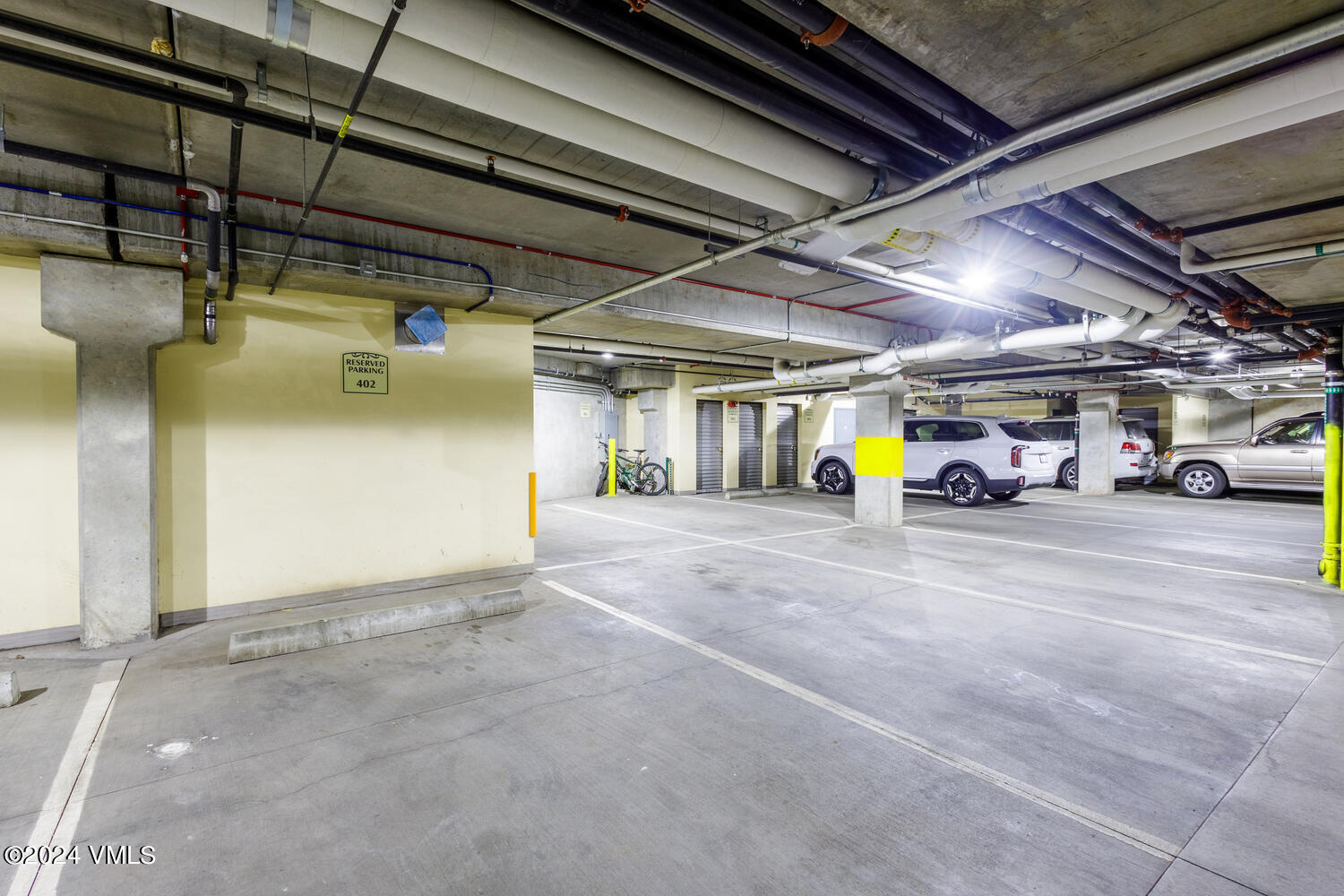 434 South Frontage Road East, Unit 402 Vail, CO 81657 - Photo 34 of 44 a view of parking garage with cars