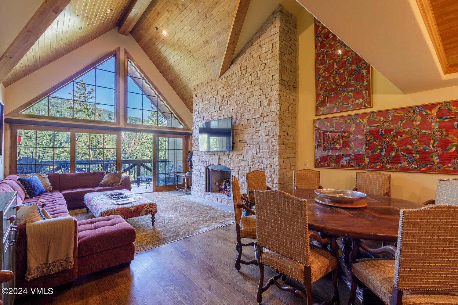 434 South Frontage Road East, Unit 402 Vail, CO 81657 - Photo 6 of 44 a living room with fireplace furniture and a floor to ceiling window