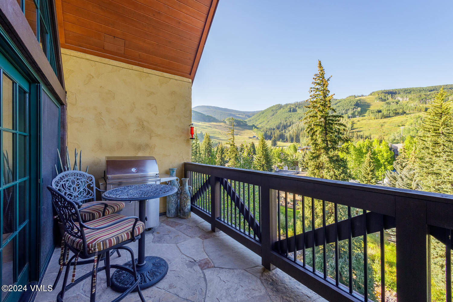 434 South Frontage Road East, Unit 402 Vail, CO 81657 - Photo 7 of 44 a view of a balcony with furniture and a potted plant