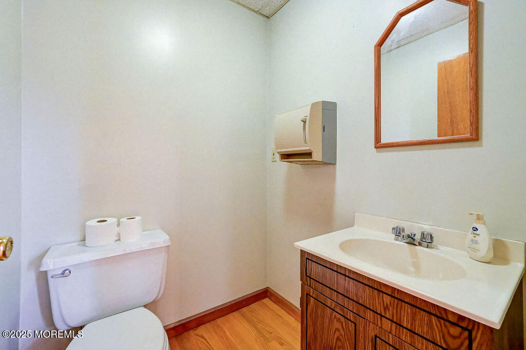 95 Broadway Keyport, NJ 07735 - Photo 17 of 31 a bathroom with a sink toilet and mirror