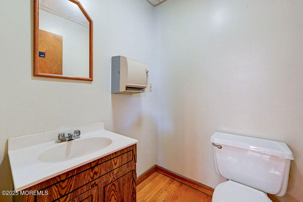 95 Broadway Keyport, NJ 07735 - Photo 18 of 31 a bathroom with a sink toilet and mirror