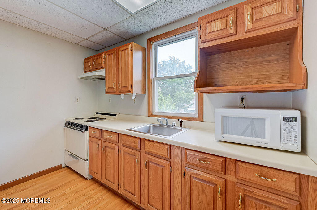 95 Broadway Keyport, NJ 07735 - Photo 19 of 31 a kitchen with stainless steel appliances granite countertop a stove a sink and a microwave