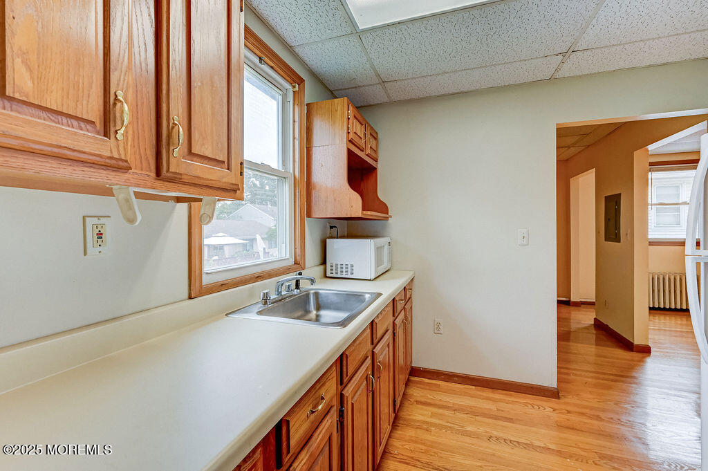 95 Broadway Keyport, NJ 07735 - Photo 20 of 31 a hallway with sink and wooden floor