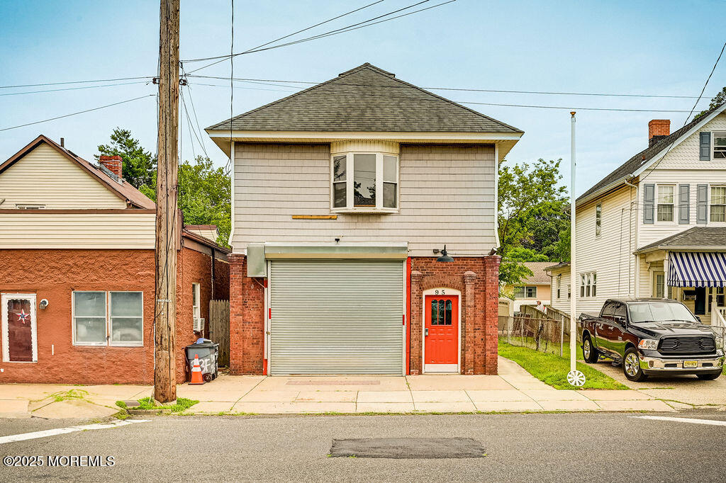 95 Broadway Keyport, NJ 07735 - Photo 2 of 31 a yellow house with a outdoor space