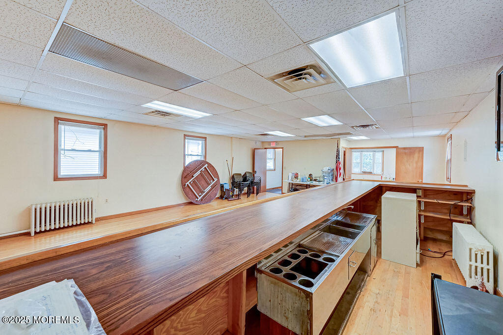 95 Broadway Keyport, NJ 07735 - Photo 22 of 31 a room with wooden floor pool table and windows