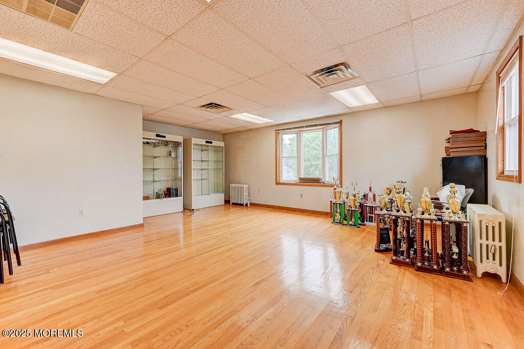 95 Broadway Keyport, NJ 07735 - Photo 25 of 31 a view of an empty room with window and wooden floor