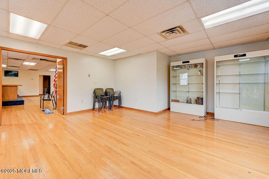 95 Broadway Keyport, NJ 07735 - Photo 26 of 31 a view of an empty room with wooden floor and a cabinet