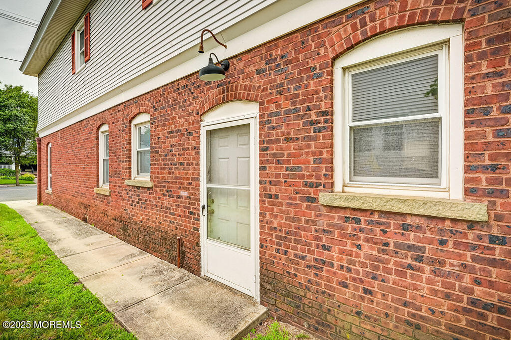 95 Broadway Keyport, NJ 07735 - Photo 28 of 31 a view of a brick house with a brick wall