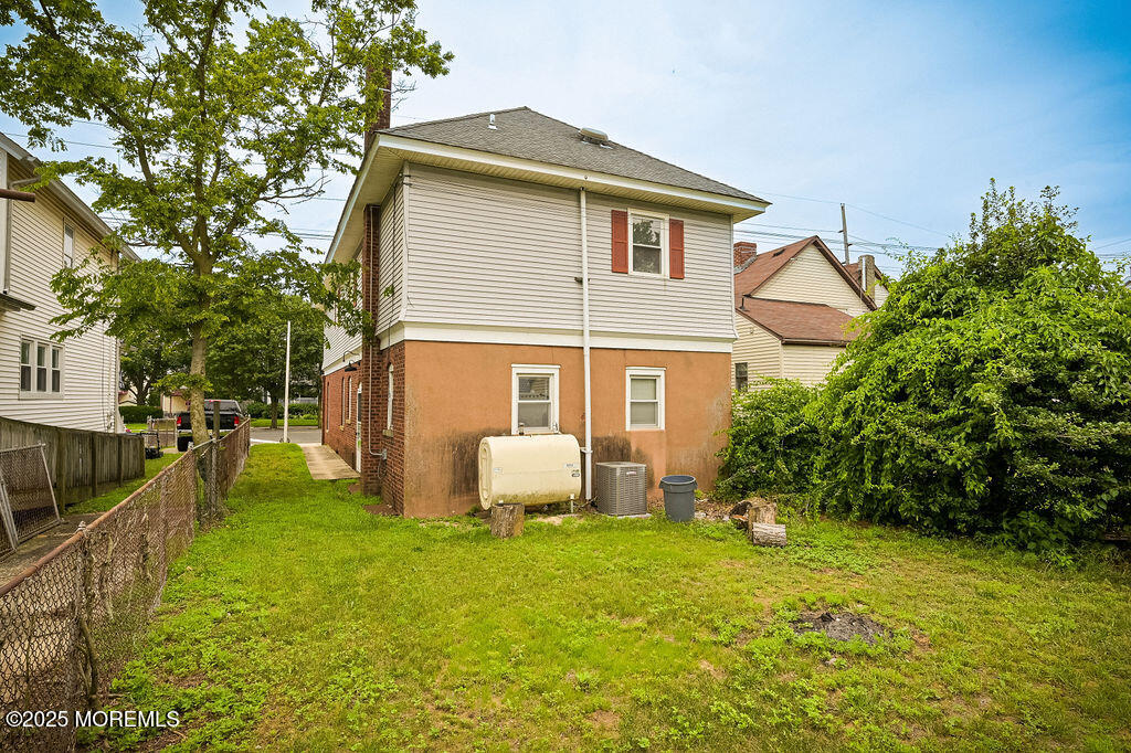 95 Broadway Keyport, NJ 07735 - Photo 30 of 31 a front view of house with garden and trees