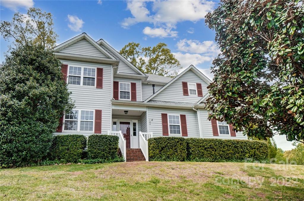 104 High Ridge Court West Mount Holly, NC 28120 - Photo 1 of 34 front view of a house with a yard
